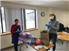 Bernice and Elizabeth filling packets